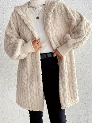 Beige hooded cocoon coat with textured cable knit, 100% polyester, open front.