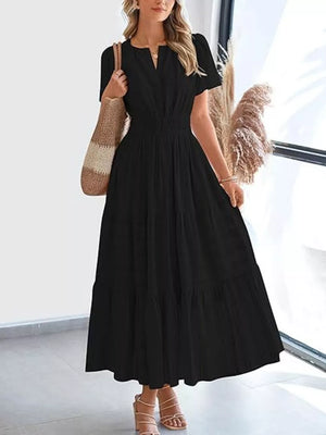Black ruched V-neck tiered midi dress with short sleeves and smocked waist.