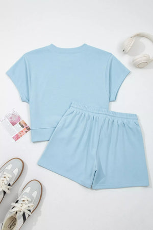 Light blue cotton crew neck t-shirt and drawstring shorts set with ribbed cuffs