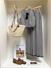 Plaid two-piece set with scalloped trim and wide-leg pants.