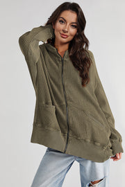 Army green waffle knit zip-through hoodie with pockets and a relaxed fit.