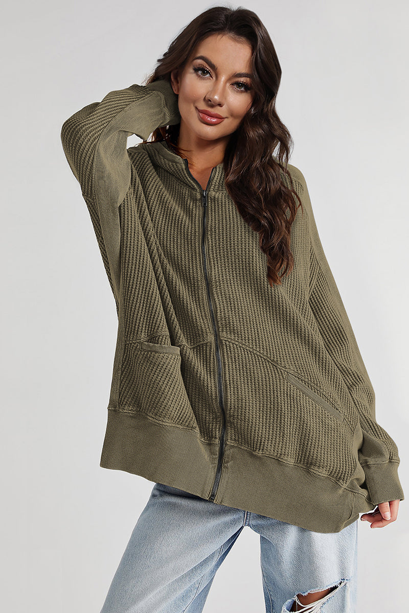 Army green waffle knit zip-through hoodie with pockets and a relaxed fit.