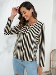 Vertical stripe blouse in tan and white with keyhole neckline and long sleeves.