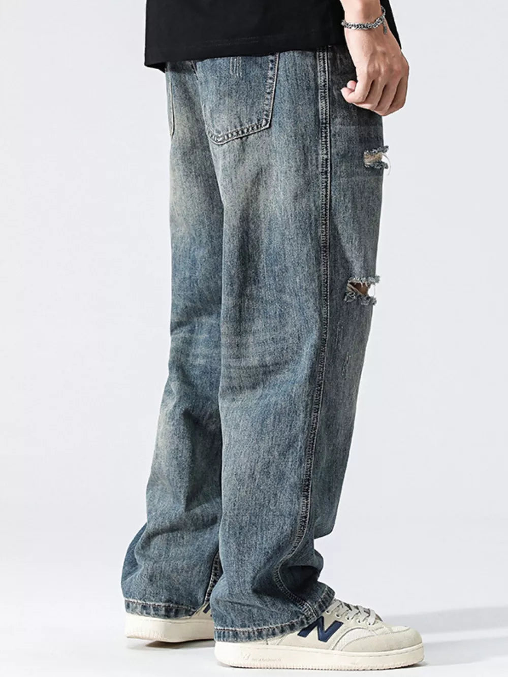 Men's Distressed Loose Fit Jeans in Blue, model styling view