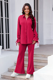 Hot Pink textured tie-sleeve co-ord set with flared pants and button-up shirt.