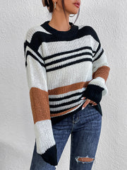 Colorblock stripe knit crewneck sweater in acrylic with black, white, and caramel stripes.