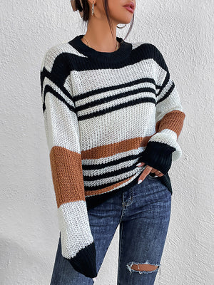 Colorblock stripe knit crewneck sweater in acrylic with black, white, and caramel stripes.