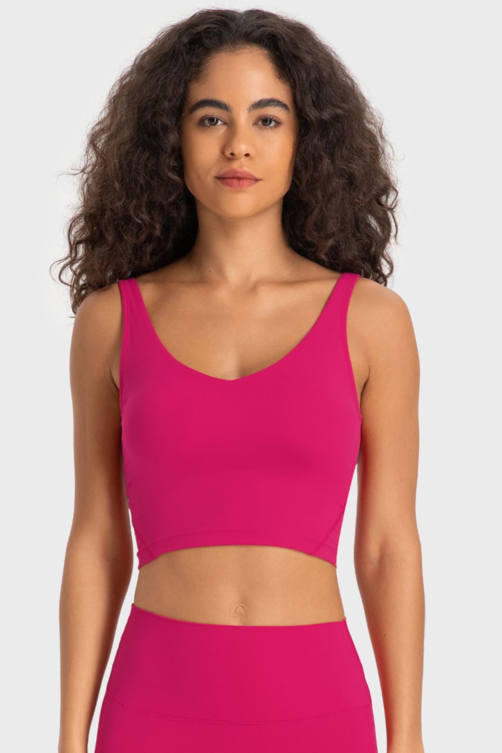 Sculpted Scoop Neck Crop Top in Hot Pink, a sleeveless activewear top with a flattering neckline.