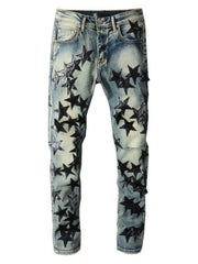 Star appliqué slim-fit denim jeans in medium wash with black star details.