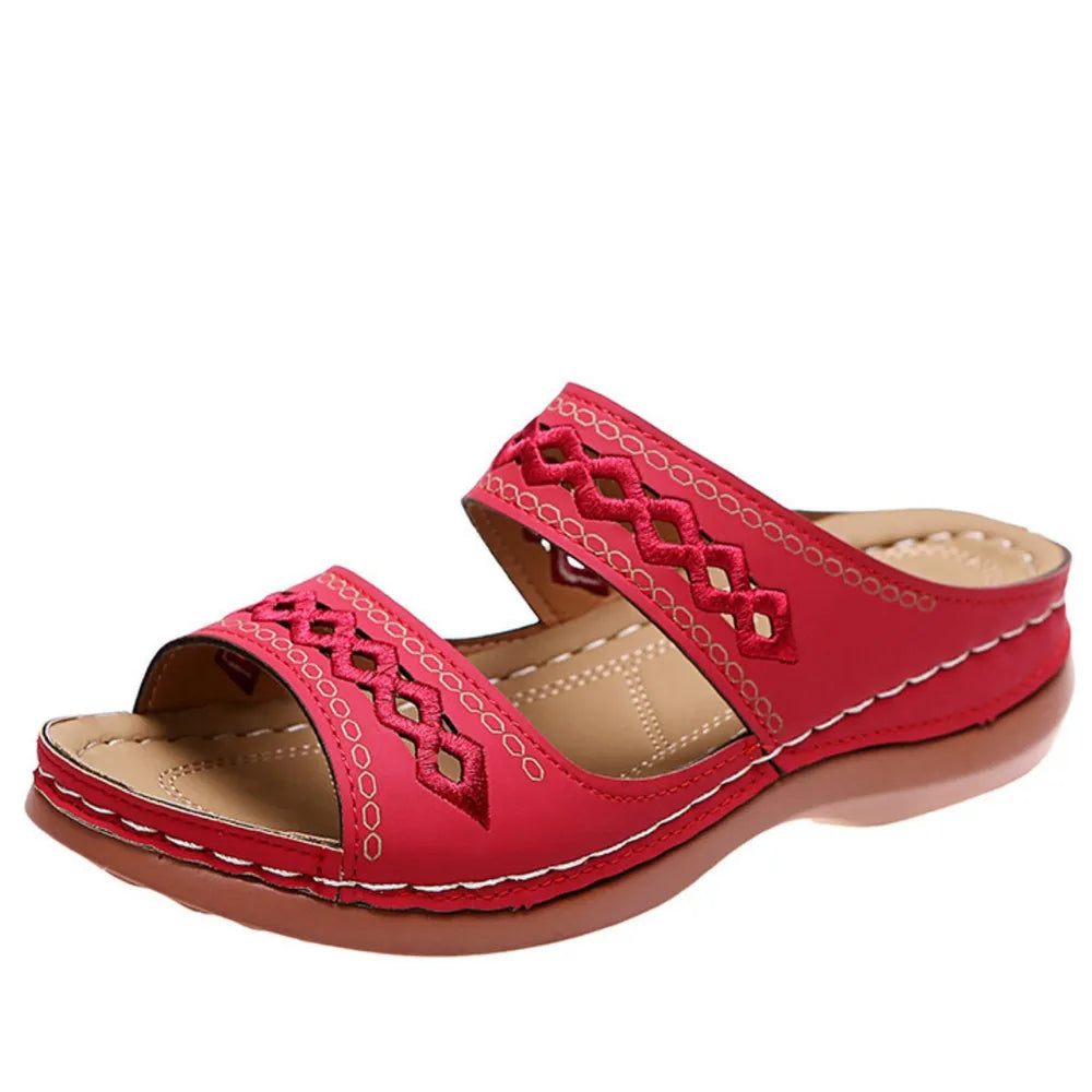 Red embroidered strap comfort slides with a contoured sole.
