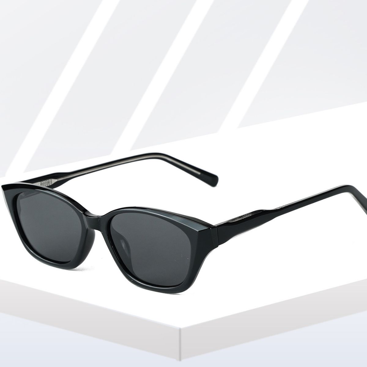 Black acetate cat-eye sunglasses with dark lenses