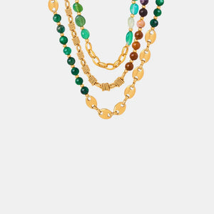 Gilded bead and chain statement necklace with green and mixed color beads.