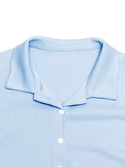 Light blue ribbed knit lounge shirt with button front and collar detail.