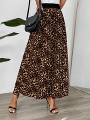 Leopard print maxi skirt with knife pleats and a black waistband.