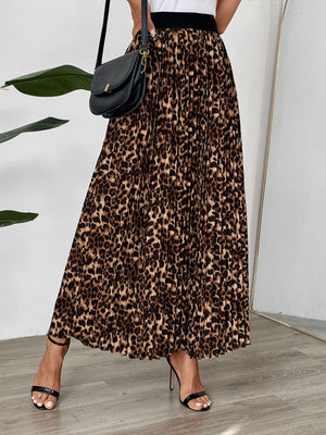Leopard print maxi skirt with knife pleats and a black waistband.