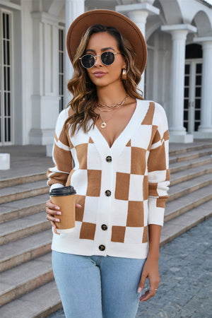 Checkerboard knit v-neck cardigan in caramel and white acrylic with button front.