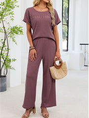 Plum purple lace cutout two-piece set with wide leg pants and short sleeves.