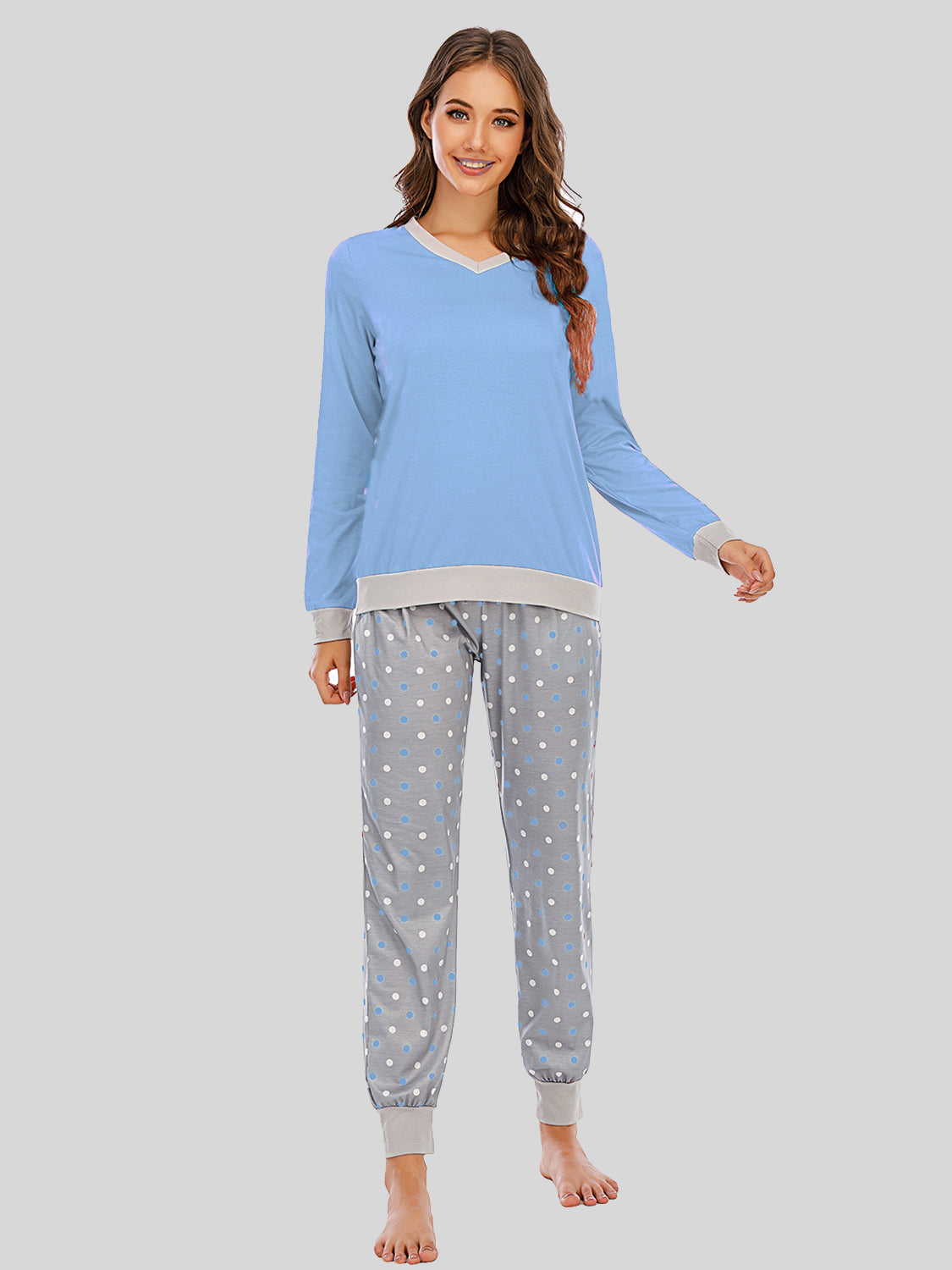 Pastel blue long sleeve lounge set with grey polka dot pants and contrast trim.