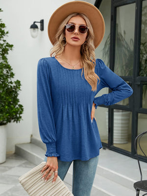 Peacock Blue blouse with pleated bodice, gathered sleeves, and smocked cuffs.