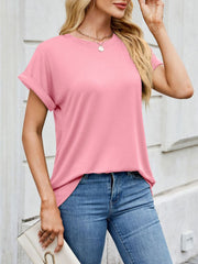 Basic blush pink t-shirt with cuffed sleeves and crew neck, styled with jeans.