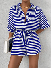 Royal blue and white striped shirt romper with button front and self-tie belt.