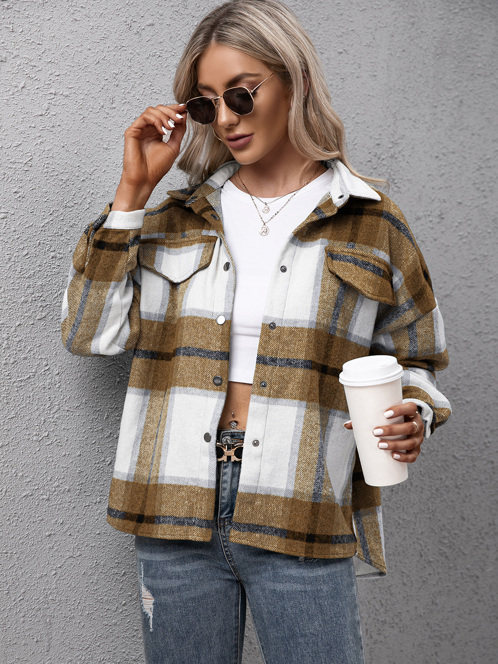 Overshirt in camel plaid with button-up front and chest pockets.