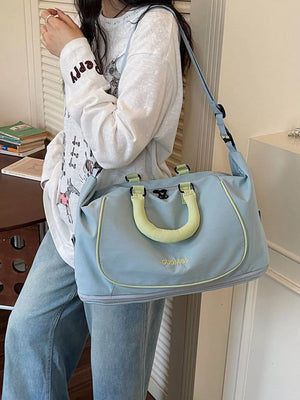 Premium Oxford cloth duffle bag in blue with yellow trim and handles, featuring a crossbody strap.