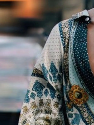 Bohemian print silk shirt with ornate brooch detail
