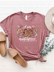 Dusty Pink graphic tee with floral typography that reads "I am GOD's masterpiece" and Ephesians 2:10.