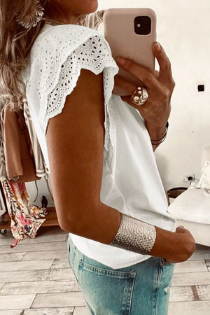 White cotton maternity t-shirt with eyelet flutter sleeves and a scoop neckline.