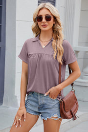 Lilac polo top with gathered yoke detail and short sleeves