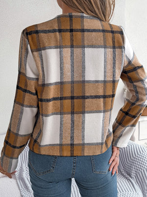 Collarless plaid cropped jacket in camel with white and black accents, long sleeves.