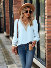 Pastel blue blouson sleeve top with embroidered trim neckline and cuffs