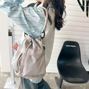 Light Gray nylon bucket bag with drawstring and chain detail