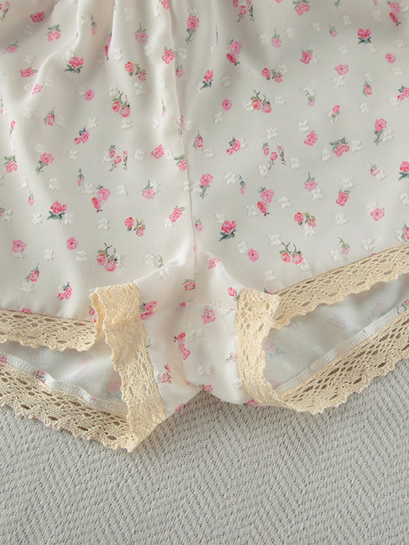 Floral lace trim cami and shorts set with delicate pink floral pattern.