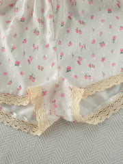 Floral lace trim cami and shorts set with delicate pink floral pattern.