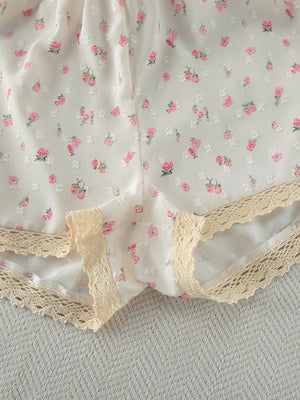Floral lace trim cami and shorts set with delicate pink floral pattern.