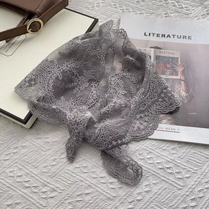 Gray lace scarf with delicate floral pattern and scalloped edges