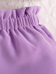 Purple baby set with ruffled waist and bow detail, cotton fabric.