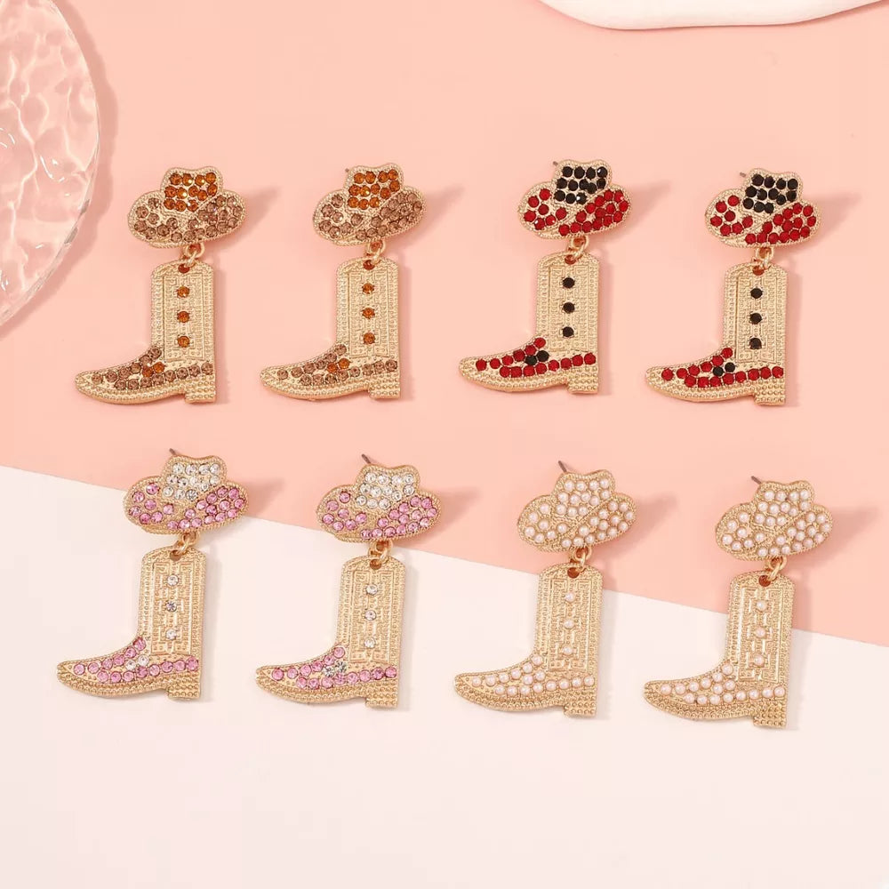 Rhinestone cowboy boot dangle earrings in red, pink, brown, and white with hat detail.