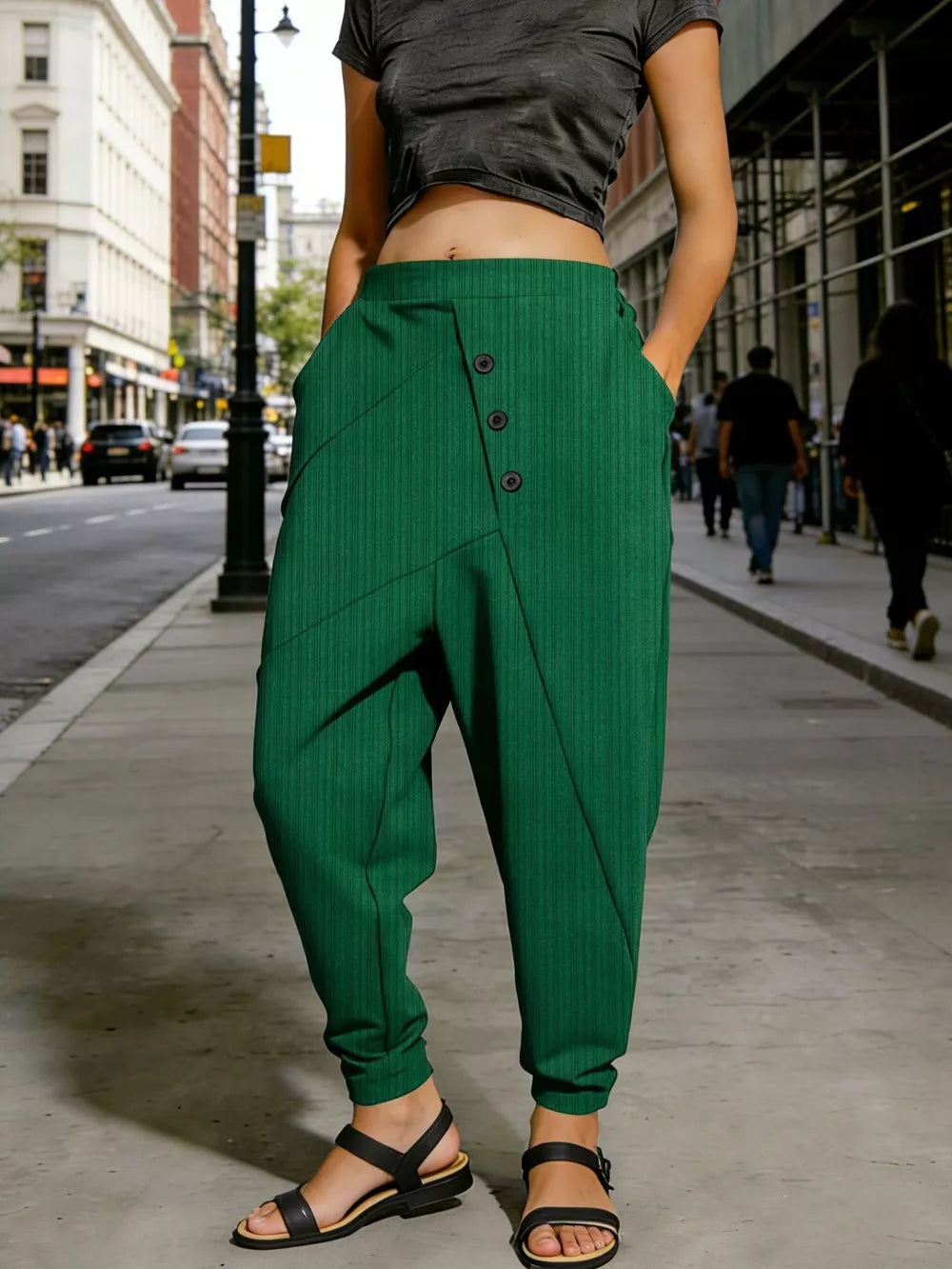 Green harem pants with decorative buttons and pockets, cuffed ankles