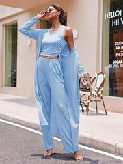Light blue ribbed knit duster, tank top, and wide-leg pants lounge set.