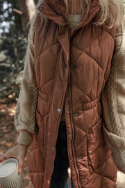 Brown diamond quilted longline vest with cinched waist detail and pockets