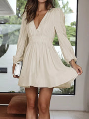 Cream V-neck mini dress with puff sleeves and elastic waist