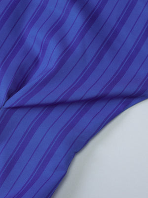 Button-down mini dress in blue with darker blue stripes, close-up detail
