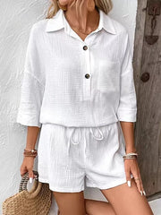 White cotton two-piece set with buttoned collared shirt and drawstring shorts