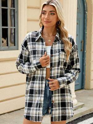 Black and white plaid distressed overshirt with relaxed fit and button front.