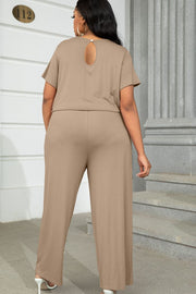 Relaxed fit jumpsuit in tan with short sleeves and a keyhole back detail.