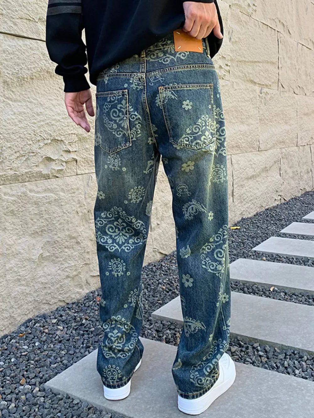 Men's relaxed fit jeans with heritage floral print in blue denim.