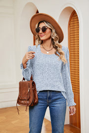 Textured square neck blouse in Pastel Blue with ruffled cuffs and long sleeves.
